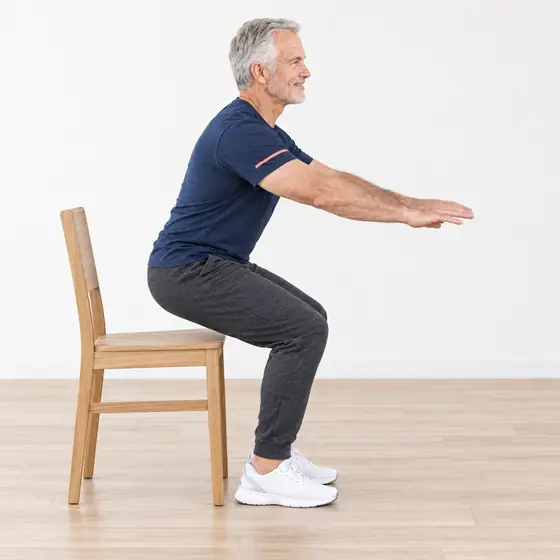 Sit to Stand: Sit near the front of the chair, feet flat.