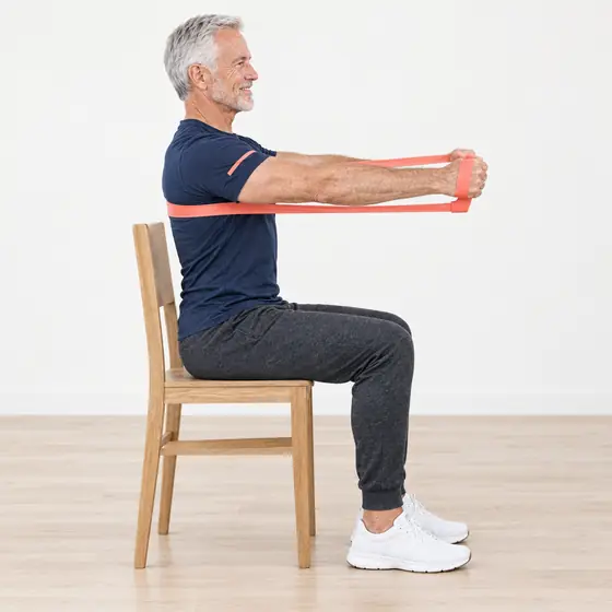 Band Chest Press: Sit tall, band around your upper back, an end in each hand at chest height.