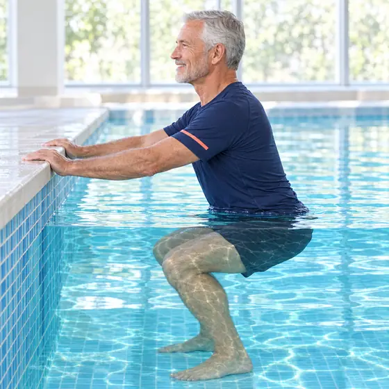 Pool Squat: Stand facing the pool edge, hands on it, feet hip-width.