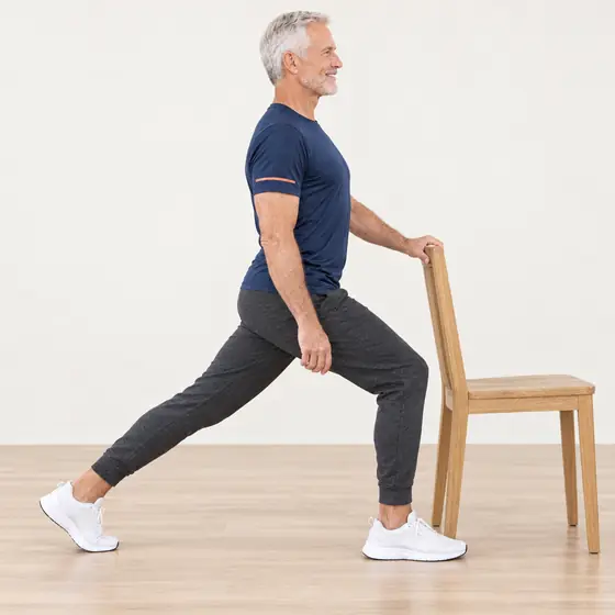 Hip Flexor Stretch: Hold the chair back and take a big step forward.
