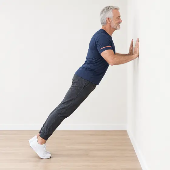 Wall Push-Up: Face the wall, hands on it at chest height, a little wider than shoulders.
