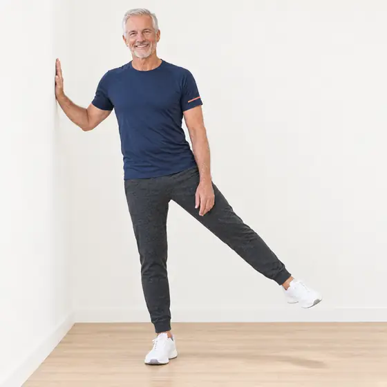 Side Leg Lift: Stand side-on to the wall, hand on it for support.